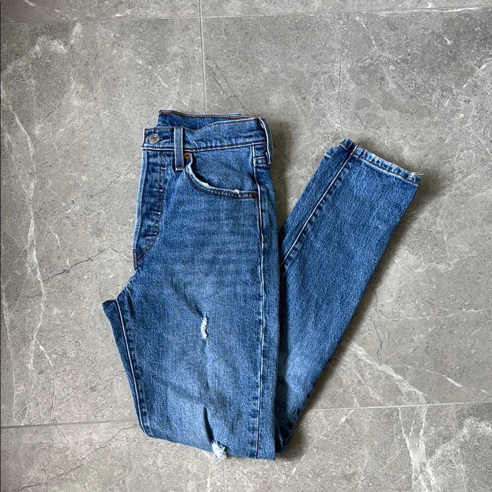 Distressed Levi’s jeans​